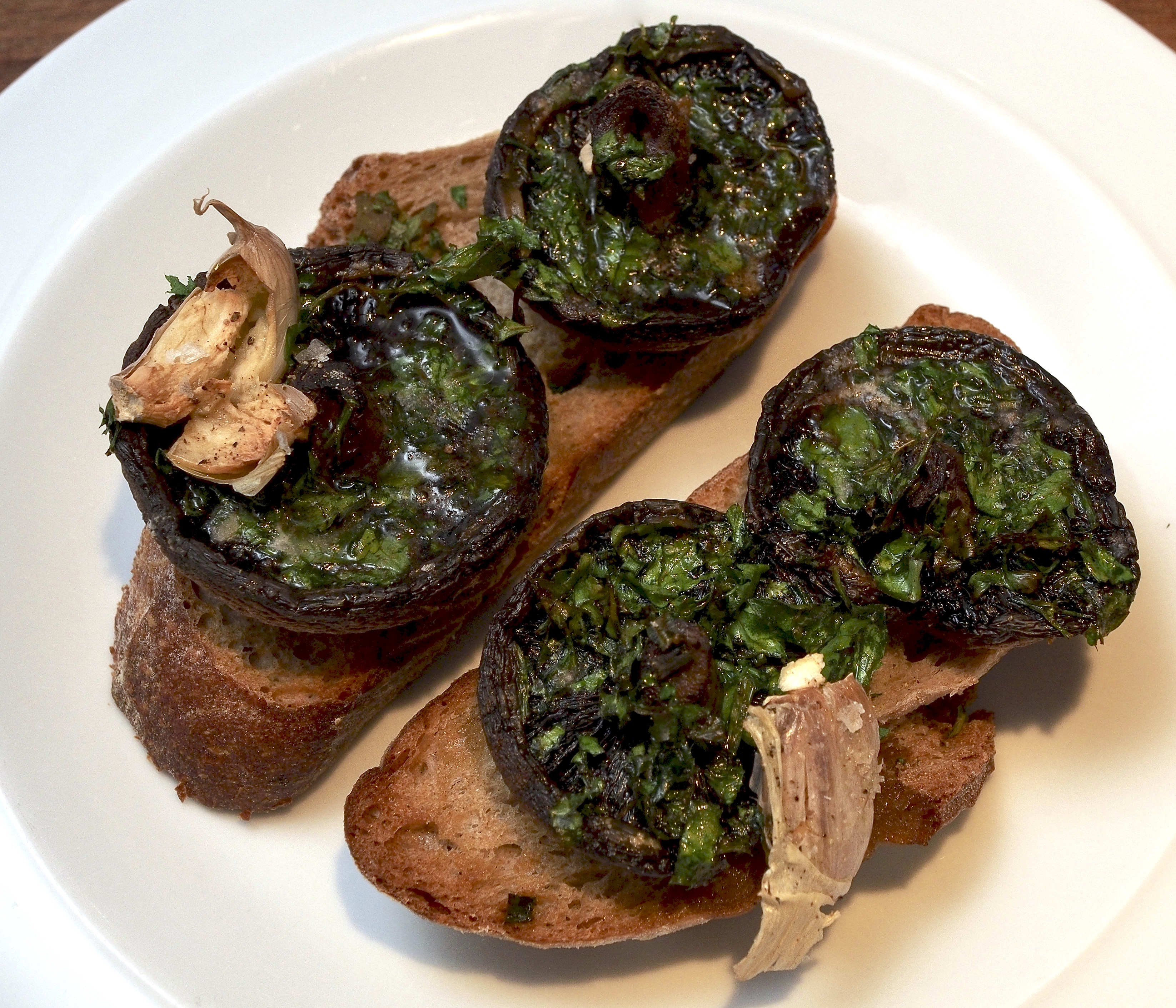 Mushrooms baked on toast with herbs, butter &amp; garlic